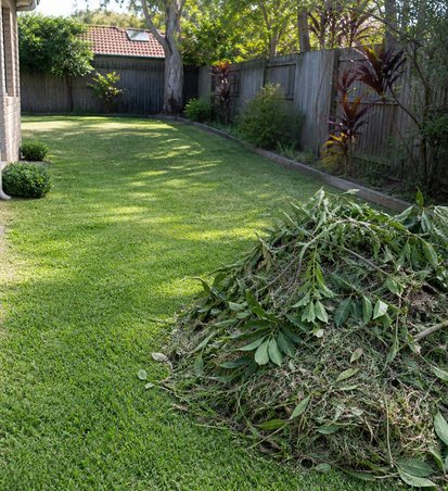 Clean backyard with green waste ready for removal